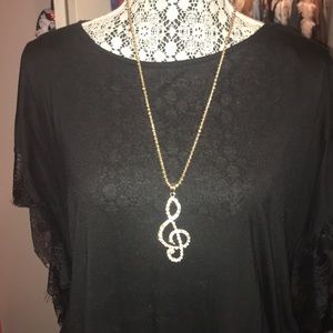 Long treble clef necklace! Sparkly and gold.